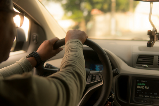 man driving car